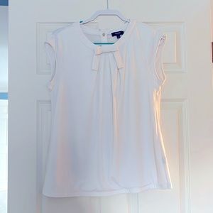 Premise stretchy sleeveless blouse. Hook missing on one side.